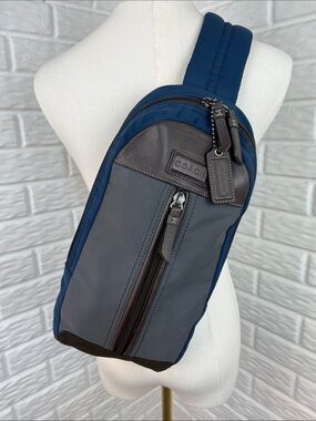 COACH Varick sling bag in navy blue / gray nylon with brown leather trim
